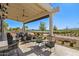 Scenic outdoor seating area with views of the golf course and lush landscaping at 17362 W Wildwood St, Surprise, AZ 85388