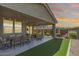 Covered patio with a view of the backyard with a built in putting green at 17362 W Wildwood St, Surprise, AZ 85388