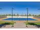 Full court tennis court with well maintained artificial turf in a community at 17362 W Wildwood St, Surprise, AZ 85388