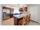 Updated kitchen with granite counters, stainless appliances, and a breakfast bar with seating at 17415 N 57Th Ave, Glendale, AZ 85308