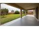 Spacious backyard with lush green grass and a covered patio, perfect for outdoor relaxation and entertaining at 17681 W Molly Ln, Surprise, AZ 85387