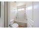 Clean bathroom features a bathtub with white tiles and a toilet next to the bathtub at 17681 W Molly Ln, Surprise, AZ 85387