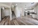 Entryway with stairs and wood-look floors leading to the open kitchen at 17681 W Molly Ln, Surprise, AZ 85387