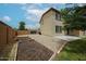 Two-story home features a spacious backyard with garden beds and gravel, perfect for outdoor enjoyment at 17681 W Molly Ln, Surprise, AZ 85387