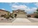Stunning two-story home featuring a neutral color scheme, a spacious two-car garage, and low maintenance desert landscaping at 17681 W Molly Ln, Surprise, AZ 85387