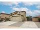 Beautiful two-story home boasting a neutral color scheme, a spacious two-car garage, and low maintenance desert landscaping at 17681 W Molly Ln, Surprise, AZ 85387