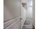 Hallway featuring wood-look floors and a built-in shelf with coat hooks at 17681 W Molly Ln, Surprise, AZ 85387