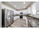 Stylish kitchen with stainless steel appliances, granite countertops, and ample storage at 17681 W Molly Ln, Surprise, AZ 85387