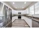 Spacious kitchen with granite counters, stainless steel appliances, and white cabinets at 17681 W Molly Ln, Surprise, AZ 85387