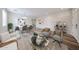 Bright, open living area features sleek furniture, stylish decor, and an inviting dining space at 17681 W Molly Ln, Surprise, AZ 85387