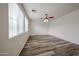 Bright living room with wood-look flooring and neutral walls at 17681 W Molly Ln, Surprise, AZ 85387