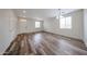 Large living room boasts wood-look floors, neutral walls, and bright natural light at 17681 W Molly Ln, Surprise, AZ 85387