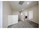 Upstairs loft area with carpet, neutral walls, and access to bedrooms and bathrooms at 17681 W Molly Ln, Surprise, AZ 85387