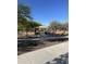 Park featuring a playground, picnic tables, mature trees, and walking paths for Gathering fun and community gatherings at 17681 W Molly Ln, Surprise, AZ 85387