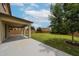 Covered patio extends to a large backyard with mature trees, creating a serene outdoor living space at 17681 W Molly Ln, Surprise, AZ 85387