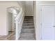 Staircase features carpeted stairs and white railing at 17681 W Molly Ln, Surprise, AZ 85387