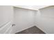 A well-organized walk-in closet with ample hanging space and neutral carpeting for a neat and tidy storage solution at 17681 W Molly Ln, Surprise, AZ 85387
