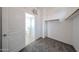 Walk-in closet with neutral paint, carpeted floor and wooden shelving at 17681 W Molly Ln, Surprise, AZ 85387