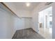 Walk-in closet with neutral paint, carpeted floor and wooden shelving at 17681 W Molly Ln, Surprise, AZ 85387
