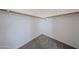 Walk-in closet with neutral paint, carpeted floor and wooden shelving at 17681 W Molly Ln, Surprise, AZ 85387