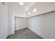 Walk-in closet with carpeted floor and wooden shelving at 17681 W Molly Ln, Surprise, AZ 85387