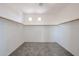Spacious walk-in closet with carpet and shelving, offering ample storage with overhead lighting at 17681 W Molly Ln, Surprise, AZ 85387