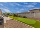 Expansive backyard featuring artificial turf, a putting green, and desert landscaping at 18226 W Marshall Ct, Litchfield Park, AZ 85340