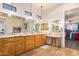 Spacious bathroom with double sinks, granite countertops, and walk-in closet access at 18226 W Marshall Ct, Litchfield Park, AZ 85340