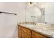 Bathroom with a vanity, granite countertop, and a mirror at 18226 W Marshall Ct, Litchfield Park, AZ 85340