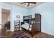 Cozy bedroom features a bunkbed and wood-look floors, creating an inviting space at 18226 W Marshall Ct, Litchfield Park, AZ 85340