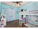 Bright bedroom features wood-look floors and ample space for sleep and play at 18226 W Marshall Ct, Litchfield Park, AZ 85340