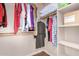 Organized walk-in closet features rods and shelves for optimal storage solutions at 18226 W Marshall Ct, Litchfield Park, AZ 85340