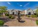 Attractive home boasting desert landscaping and a front yard fountain at 18226 W Marshall Ct, Litchfield Park, AZ 85340