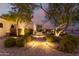 Elegant home featuring soft lighting accenting the walkway leading to the front door at 18226 W Marshall Ct, Litchfield Park, AZ 85340