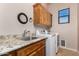 Functional laundry room features granite counters, a sink, cabinets, and modern washer and dryer at 18226 W Marshall Ct, Litchfield Park, AZ 85340