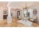 Bright living room with tile floors, columns, and arched entryways leading to other parts of the home at 18226 W Marshall Ct, Litchfield Park, AZ 85340