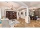 Open-concept living room featuring elegant columns, stone accents, and travertine flooring at 18226 W Marshall Ct, Litchfield Park, AZ 85340