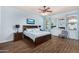 A main bedroom featuring wood floors, blue walls, and comfortable furnishings at 18226 W Marshall Ct, Litchfield Park, AZ 85340
