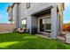 Low maintenance backyard with artificial turf, patio, and outdoor seating area at 1829 N 43Rd Ter, Phoenix, AZ 85008