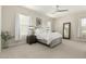 Bright bedroom with white linens, neutral walls, and natural light at 1829 N 43Rd Ter, Phoenix, AZ 85008