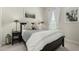 Comfortable bedroom featuring a plush comforter and a black, wooden bed frame at 1829 N 43Rd Ter, Phoenix, AZ 85008