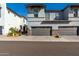 Charming two-story home with a gray stucco exterior and well-maintained front yard at 1829 N 43Rd Ter, Phoenix, AZ 85008