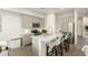 Modern kitchen features stainless steel appliances, a center island, and sleek countertops at 1829 N 43Rd Ter, Phoenix, AZ 85008