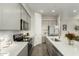 Well-equipped kitchen with gray cabinets, stainless steel appliances, and a center island at 1829 N 43Rd Ter, Phoenix, AZ 85008