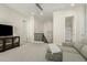 Upstairs living room featuring neutral carpet, TV, and staircase at 1829 N 43Rd Ter, Phoenix, AZ 85008