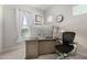 Inviting office featuring a large desk, comfortable chair, and natural light at 1829 N 43Rd Ter, Phoenix, AZ 85008