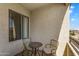 Comfortable balcony featuring seating, a table, and a scenic neighborhood view at 18416 N Cave Creek Rd # 3034, Phoenix, AZ 85032