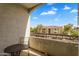 Relaxing balcony offers seating, a table, and a view of nearby apartments at 18416 N Cave Creek Rd # 3034, Phoenix, AZ 85032