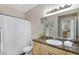 Bathroom features a single sink vanity with framed mirror, and shower with curtain at 18416 N Cave Creek Rd # 3034, Phoenix, AZ 85032