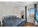 Comfortable bedroom includes a window view, closet, and contemporary furnishings at 18416 N Cave Creek Rd # 3034, Phoenix, AZ 85032